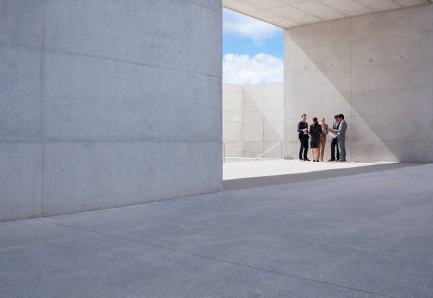 business people meeting outside modern building - 단정한 사무복 뉴스 사진 이미지