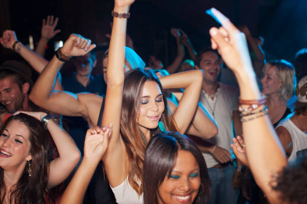istock Crowd dancing on dance floor of nightclub 160993180