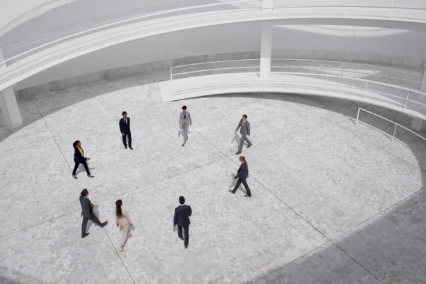 istock Business people walking in modern courtyard 160993210