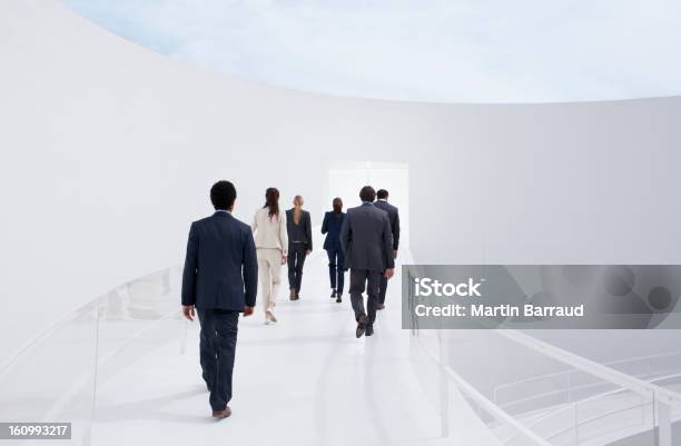 Business People Walking Toward Doorway Stock Photo - Download Image Now - Rear View, Walking, Business