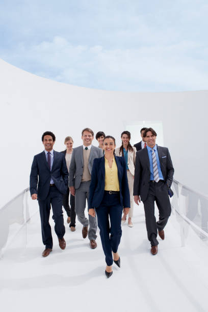 portrait of smiling business people on walkway - clothing well dressed smiling front view 뉴스 사진 이미지