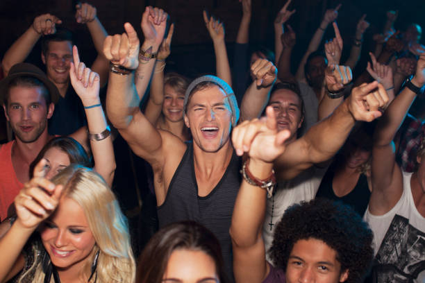 istock Enthusiastic man cheering in crowd at concert 160993250