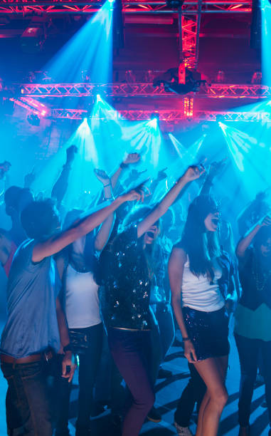 istock Crowd cheering with arms raised at concert 160993283