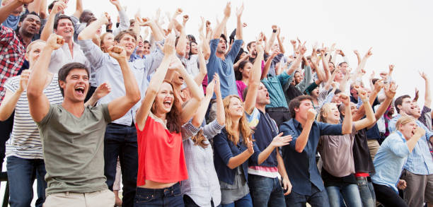 Cheering fans in crowd  cheering stock pictures, royalty-free photos & images
