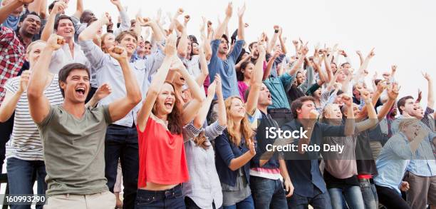 Cheering Fans In Crowd Stock Photo - Download Image Now - Crowd of People, Fan - Enthusiast, Sport