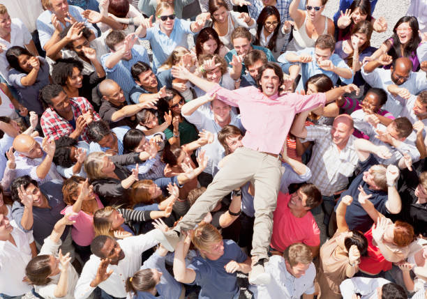 Portrait of enthusiastic man crowd surfing  mosh pit stock pictures, royalty-free photos & images