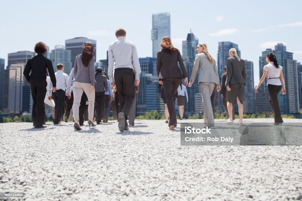 Business people walking toward city  The Way Forward Stock Photo