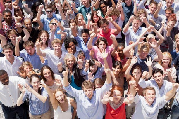 istock Portrait of crowd cheering with arms raised 160993347