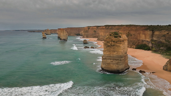 Westward view from the official viewpoint of the so-called Twelve Apostles rock stacks eroded from the Port Campbell Limestone unit dated in the Mid-Late Miocene epoch. Corangamite Shire-VIC-Australia