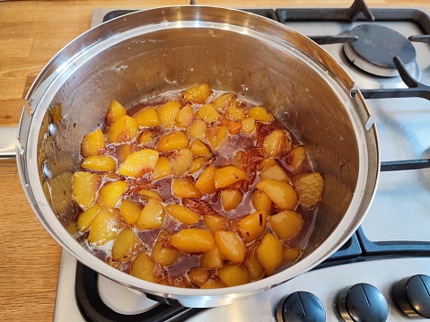 Homemade peach jam in pan at glasgow Scotland england uk