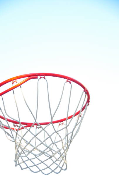 istock Basketball hoop against bright sky 1609979300