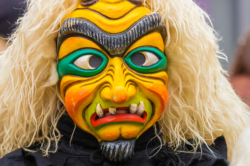 Ulm, Germany - January 29, 2023: Festival participants dressed up in handmade costume and mask at the Ulmzug carnival event.