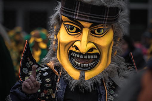 Ulm, Germany - January 29, 2023: Festival participants dressed up in handmade costume and mask at the Ulmzug carnival event.