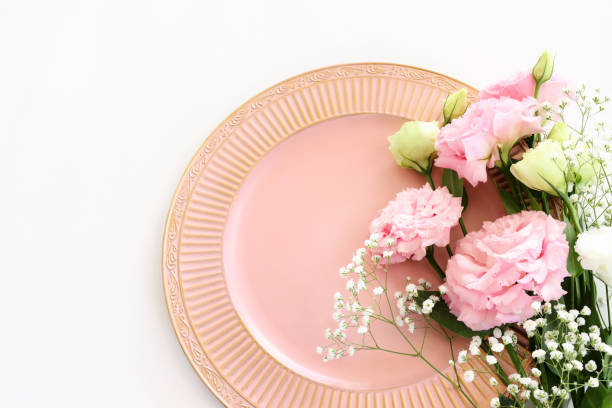 istock Top view image of delicate pink flowers over white background 1609991203