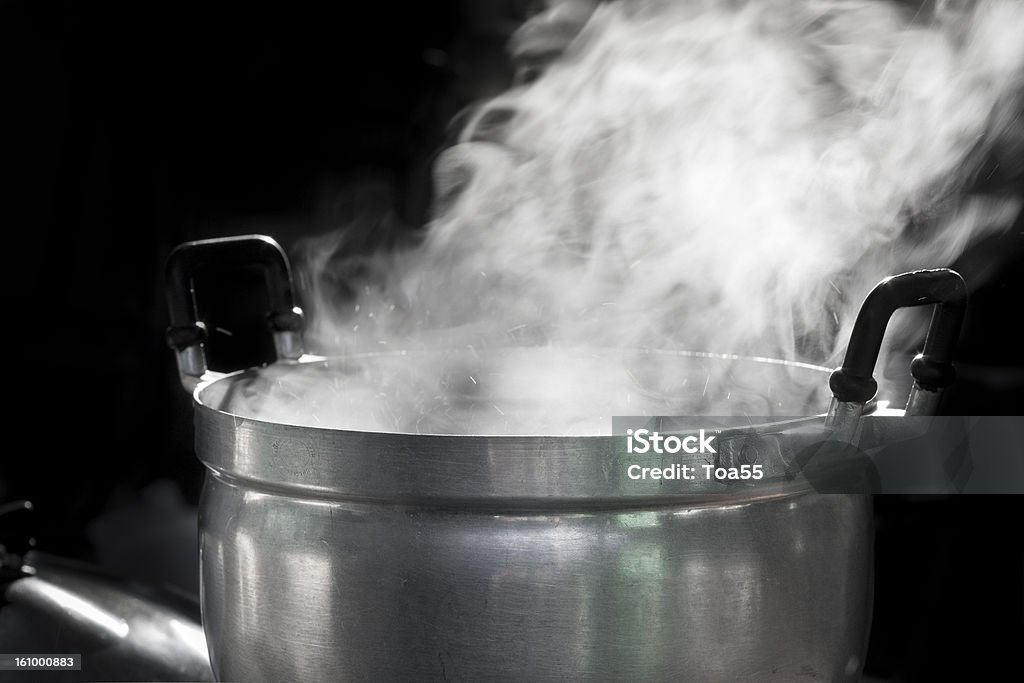 steam on pot steam on pot in kitchen Boiling Stock Photo