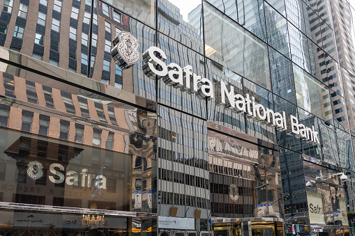 New York City, NY, USA - August 17, 2022: Safra National Bank sign on the office building on Fifth Avenue in New York City. Safra National Bank of New York (SNBNY) is a nationally chartered U.S.