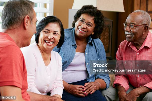 Group Of Senior Friends Chatting At Home Together Stock Photo - Download Image Now - Senior Adult, Group Of People, Discussion
