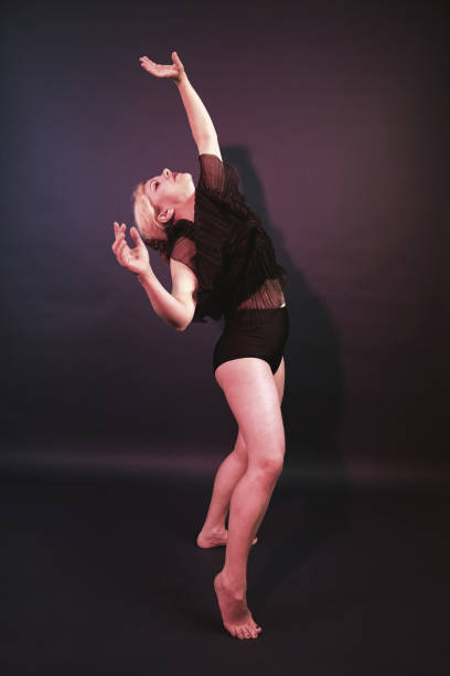 istock Caucasian White Female Model Performs Flexible Ballet Poses In Photo Studio - Creative Studio Photography 1610039678