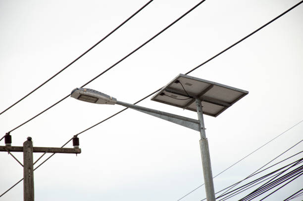istock Street lighting pole with photovoltaic panel and LED lamp lights 1610041759