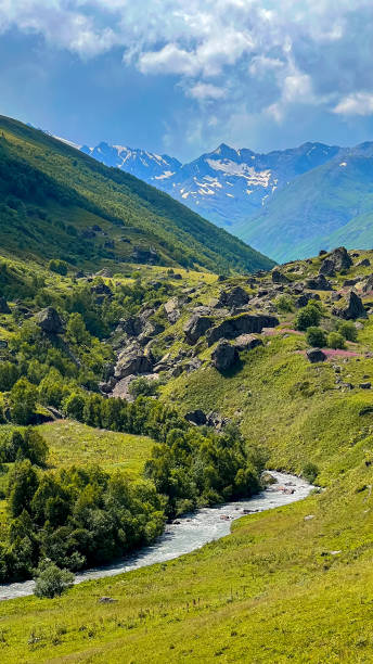 istock panorama of summer mountains with waterfalls 1610051938