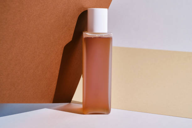 istock Container for cream, shampoo, toiletries, spa. Unbranded white and plastic bottles. Bottle with a dispenser for cosmetics. Skin care and beauty concept. Mockup style, copy space 1610059859
