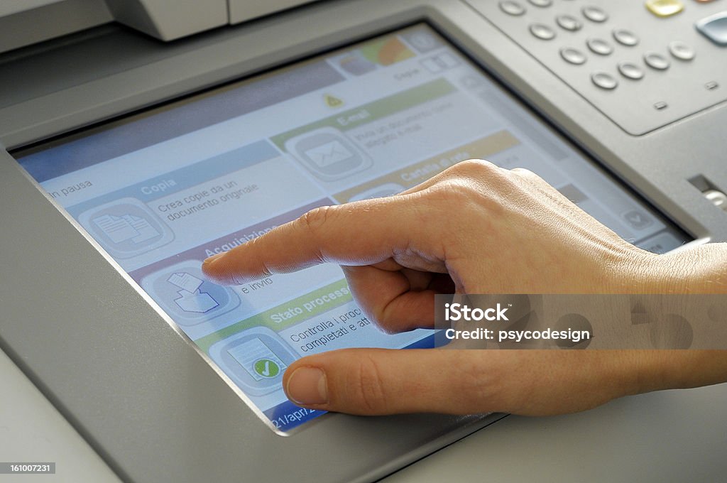 hand on touchscreen hand on touchscreen selecting program Machinery Stock Photo