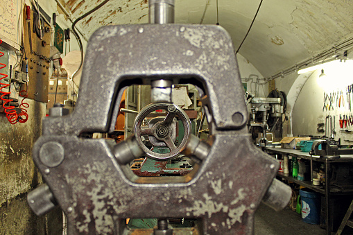 An old lathe workshop! That sounds fascinating. Lathes have been used for centuries as essential tools in machining and woodworking. They are versatile machines that rotate a workpiece on its axis, allowing for precision cutting, shaping, and drilling operations.