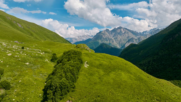 istock panorama of summer mountains with waterfalls 1610088330