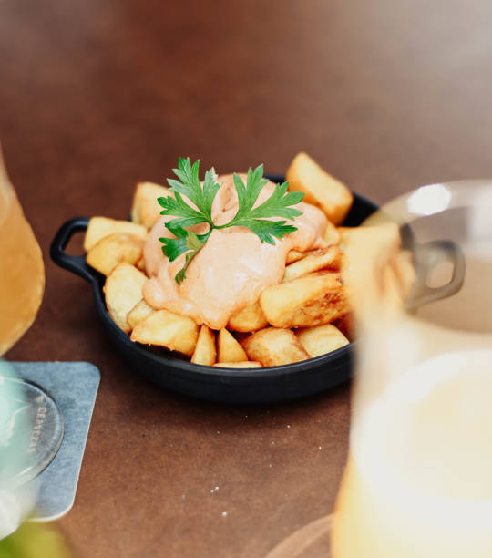Portion of patatas bravas with spicy sauce