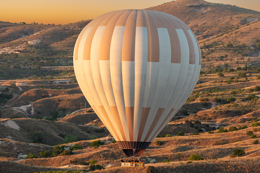 Albuquerque, New Mexico - USA - Oct 14, 2023: Hot air balloons preparing to launch at sunrise at the Albuquerque International Balloon Fiesta.