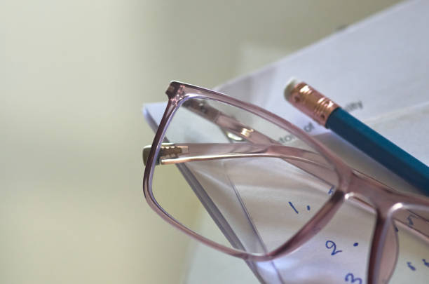 istock Eyeglasses on the notebook by the pencil 1610137504