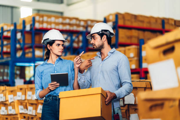 istock Warehouse worker working in warehouse storage. Foreman or worker work at factory site check up products in site. Inventory worker working in  factory Storehouse 1610151567