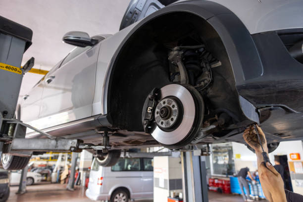 istock Checking the brake disk of a car on lift at the workshop 1610181365