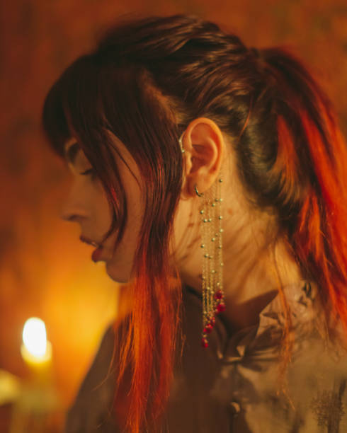 redhead-gothic-girl-in-dress-with-corset-candle-light.jpg?s=612x612&w=0&k=20&c=pvmgzb5jKtrPjykOvMFv_YVECCBMZo7bi9XZhqIPaqQ=
