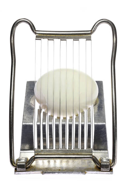 istock vintage aluminium egg slicer with hard-boiled chicken egg 1610225621