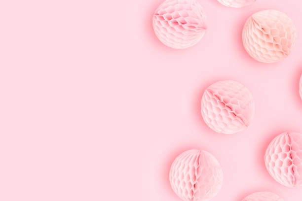 istock Small tissue paper balls scattered on a pink background. 1610287552