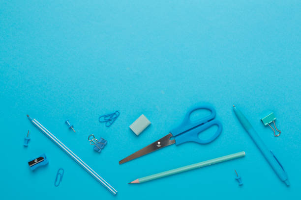istock Flat lay with blue school stationery on color backgroung, top view 1610296932