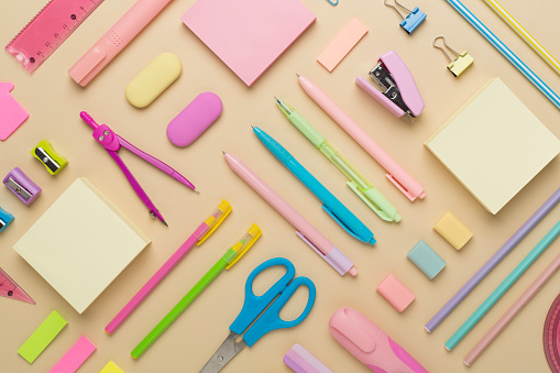 Flat lay with colorful school stationery on color backgroung, top view