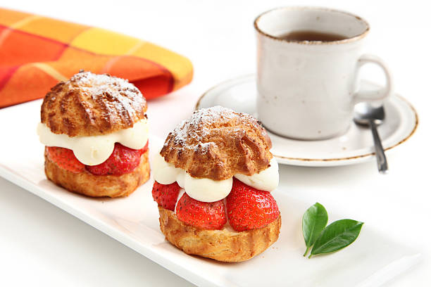 Strawberry cakes and cup of coffee stock photo