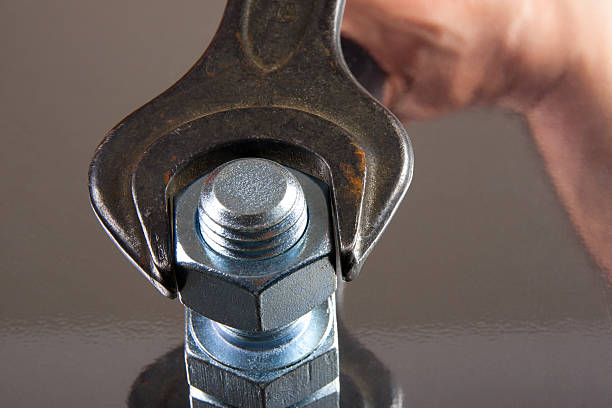 istock Wrench in Hand and Sqrews 161030250