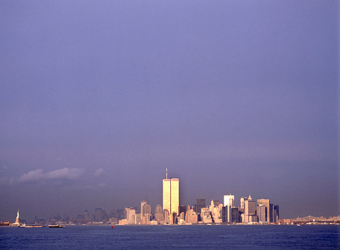 New York City at sunset with the old World Trade Center and the Staue of Liberty