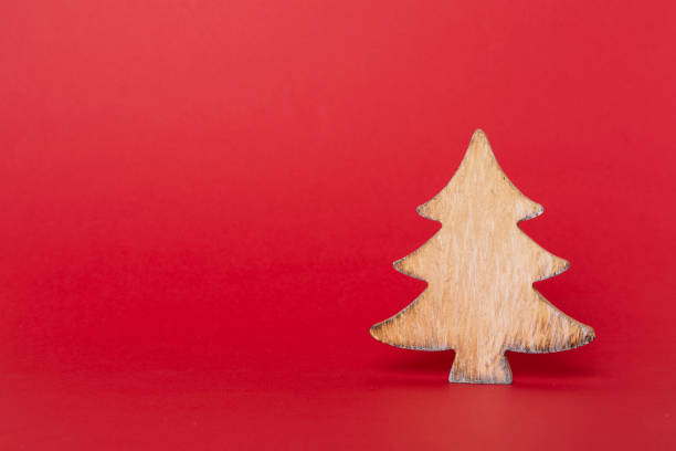 istock Wooden Christmas tree on color backgrond 1610322687