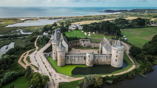 Sarzeau, Morbihan, France - 12th August 2023: Drone point of view still image of Château de Suscinio or de Susinio, the residence of the Dukes of Brittany built in the late Middle ages.