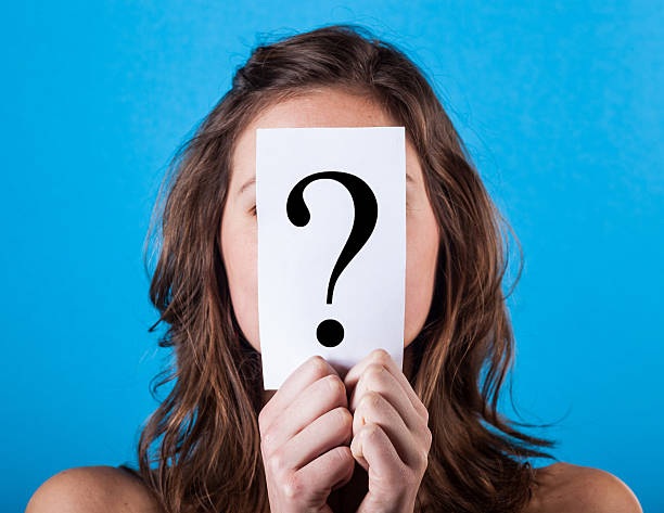 istock Woman Hiding Behind a Question Mark 161034810