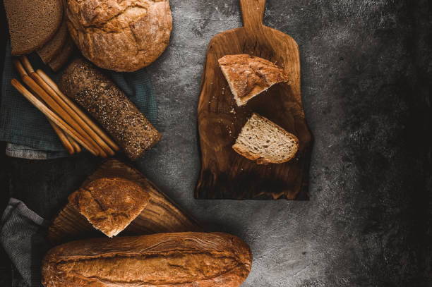 istock Fresh baked homemade bread on a table. 1610362708