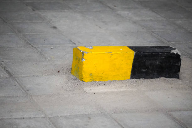 istock Car wheel safety concrete 1610363237