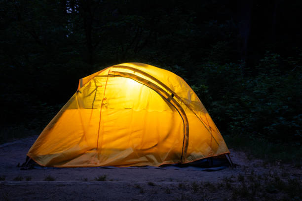 istock Yellow two person tent at night 1610395988