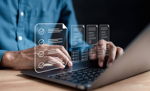 istock Online survey and digital form checklist by laptop computer, Document Management Checking System, online documentation database and process manage files. 1610418910