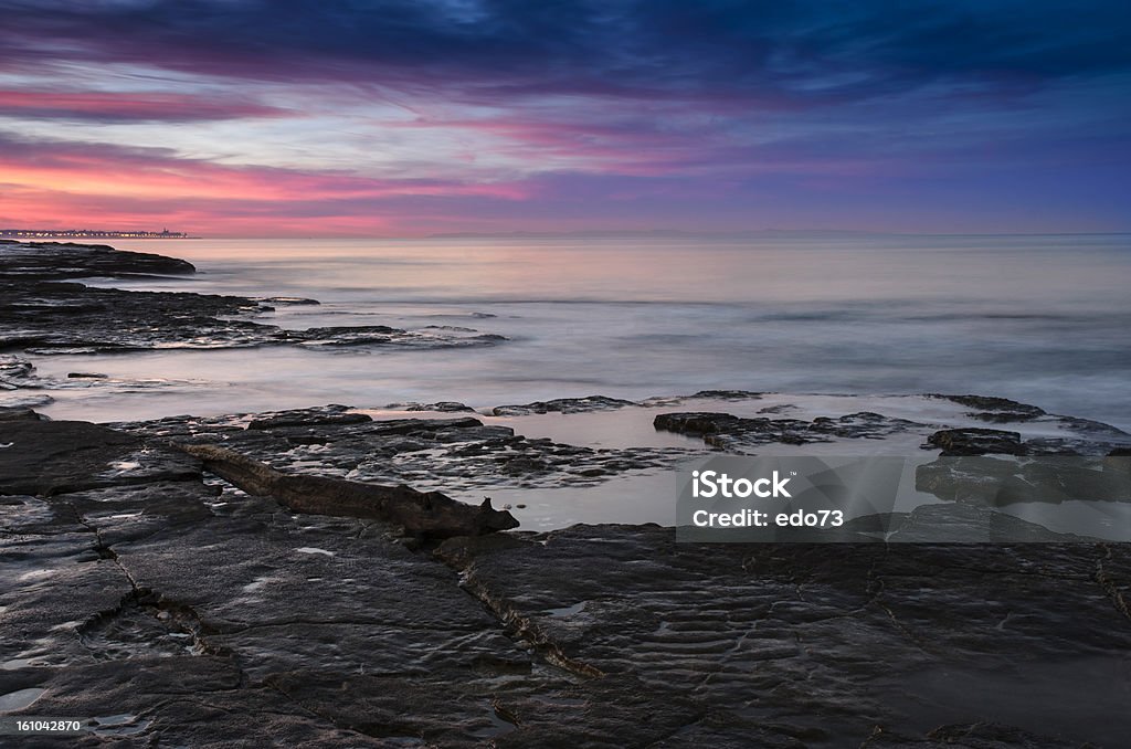 Mar y las rocas al atardecer, Apulia, Italia - Foto de stock de Agua libre de derechos