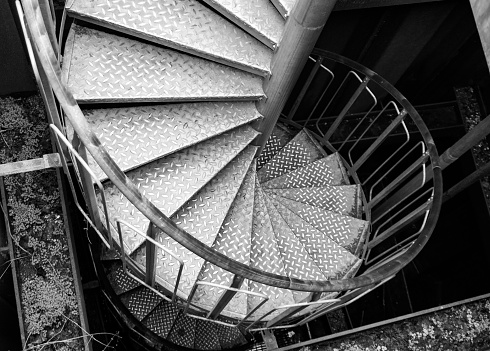 High angle view of a spiral staircase in black and white